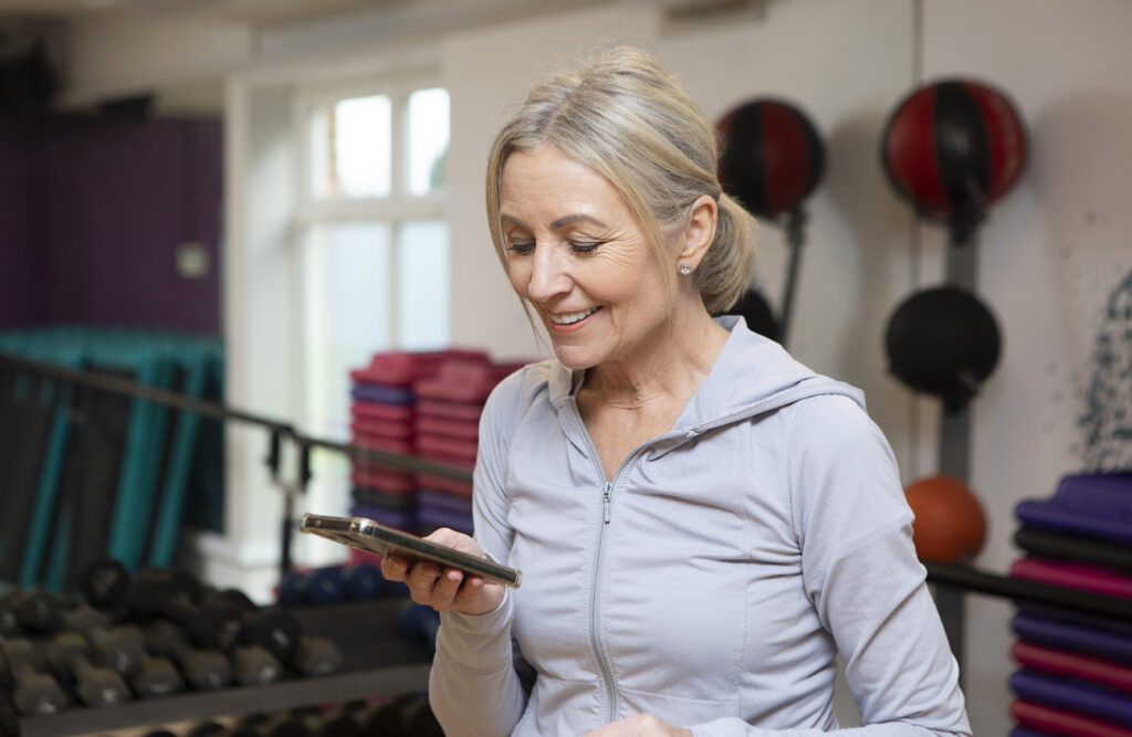 Health and fitness: One mature woman in an exercise studio