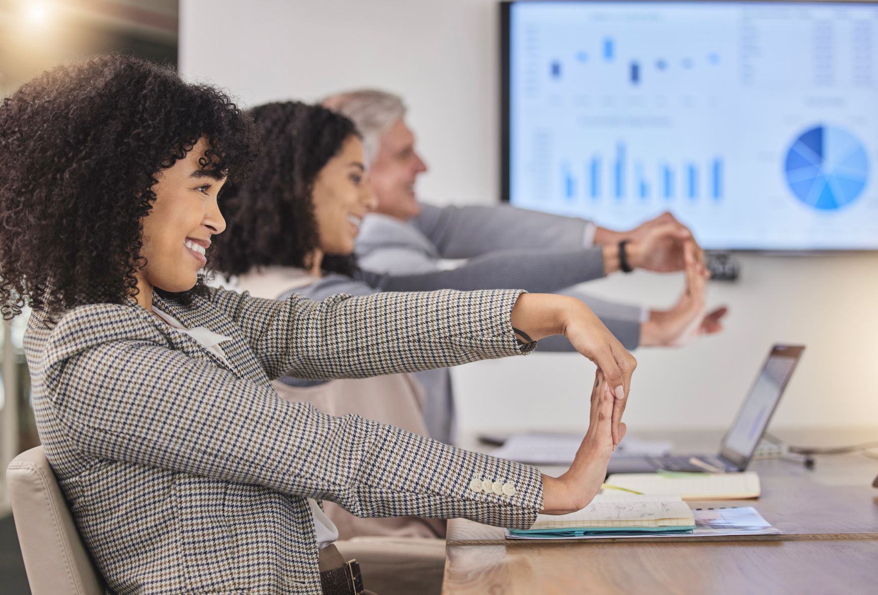Gym trainer leading corporate wellness session